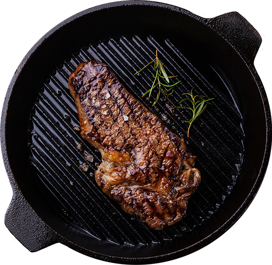 retail steak cut in cask iron skillet