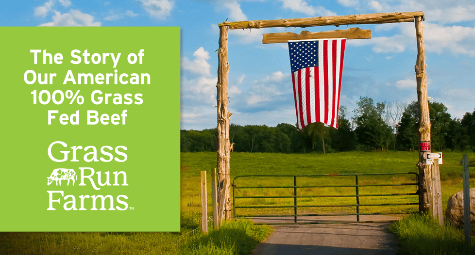 The story of our american 100% grass fed beef grass run farms image of american flag hanging on entrance to a field