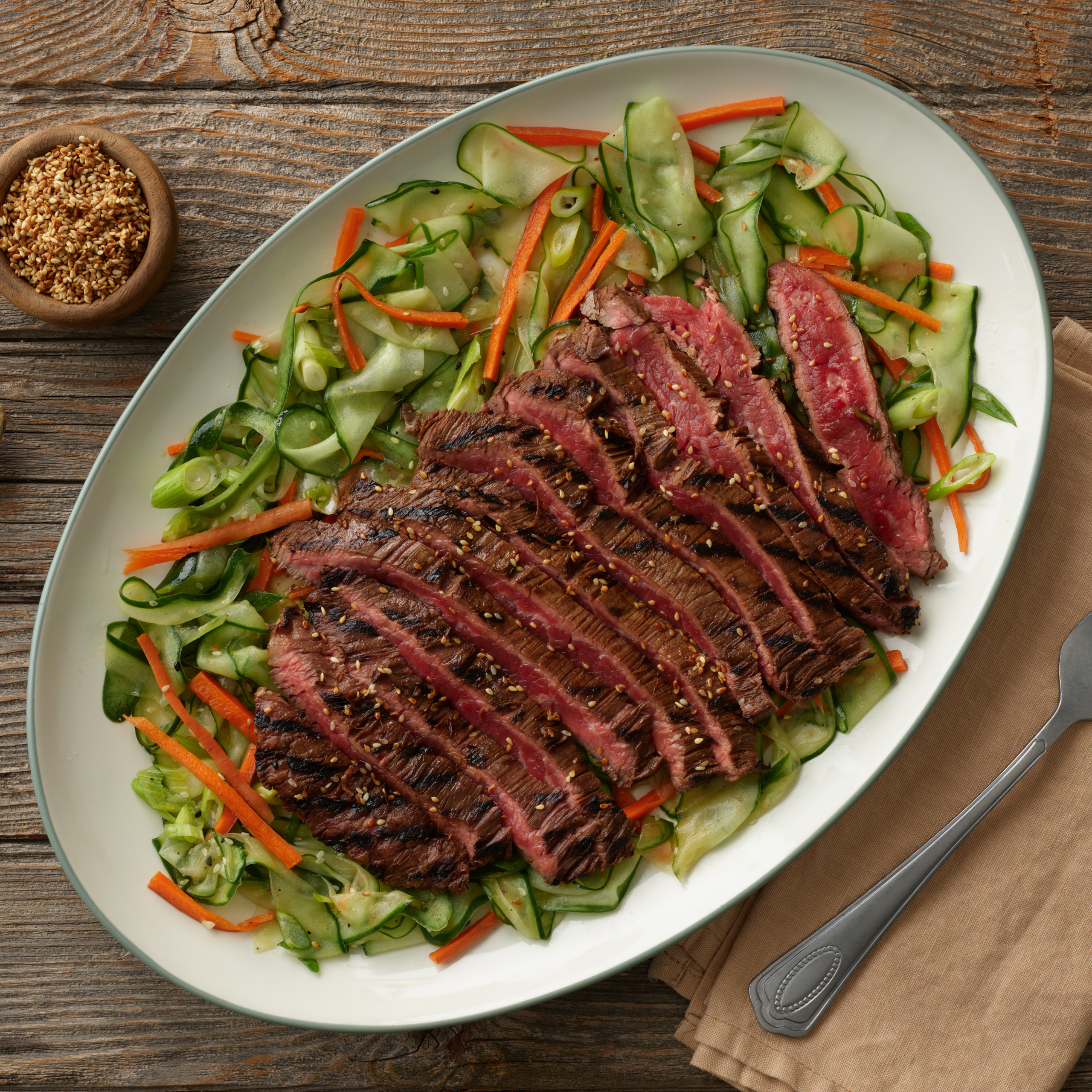 Asian Marinated Flank Steak with Sesame Cucumber Ribbon Salad